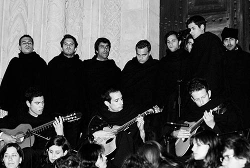 Coimbra students playing fado in a serenade at the front door of the Old Cathedral of Coimbra.jpg