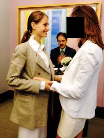Dr. Shuliak holding the arms of the woman she married in 2013 at their wedding ceremony. The Times is obscuring the image of the woman, who has claimed to be one of Mr. Epstein’s victims.Credit...Department of Justice.jpg